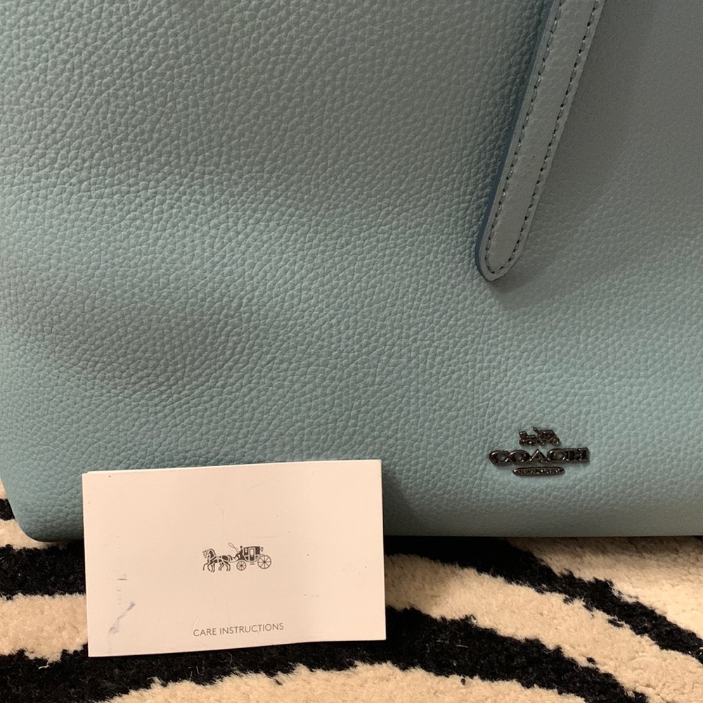 Coach tote light blue darker blue inside. Used hardly.